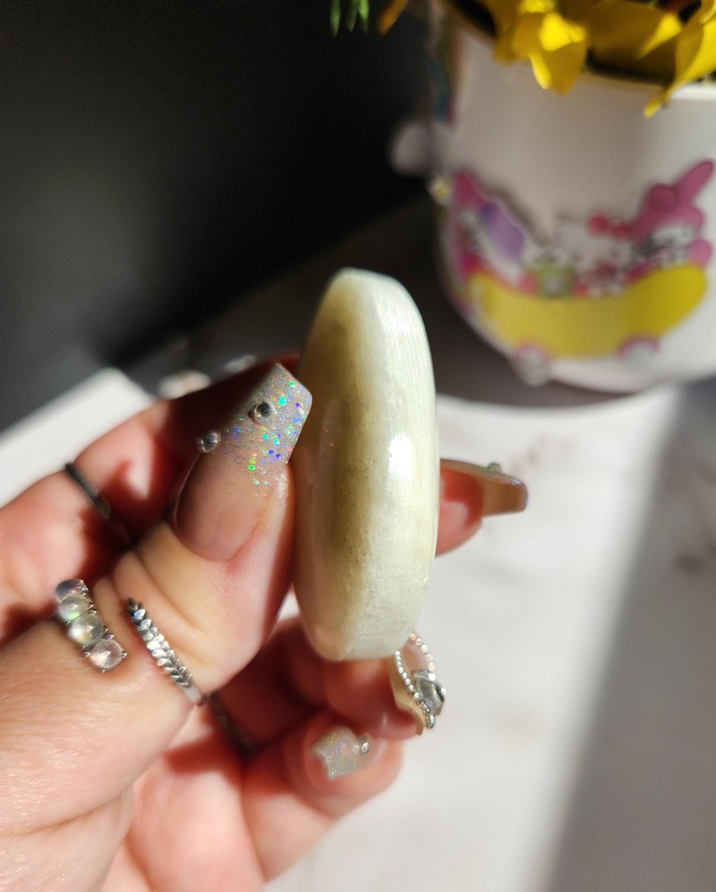 High quality blue moonstone palm stone with white and blue flash from Madagascar A24