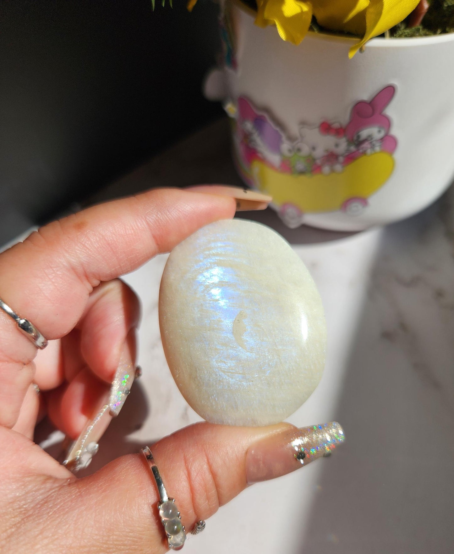 High quality blue moonstone palm stone with white and blue flash from Madagascar A24