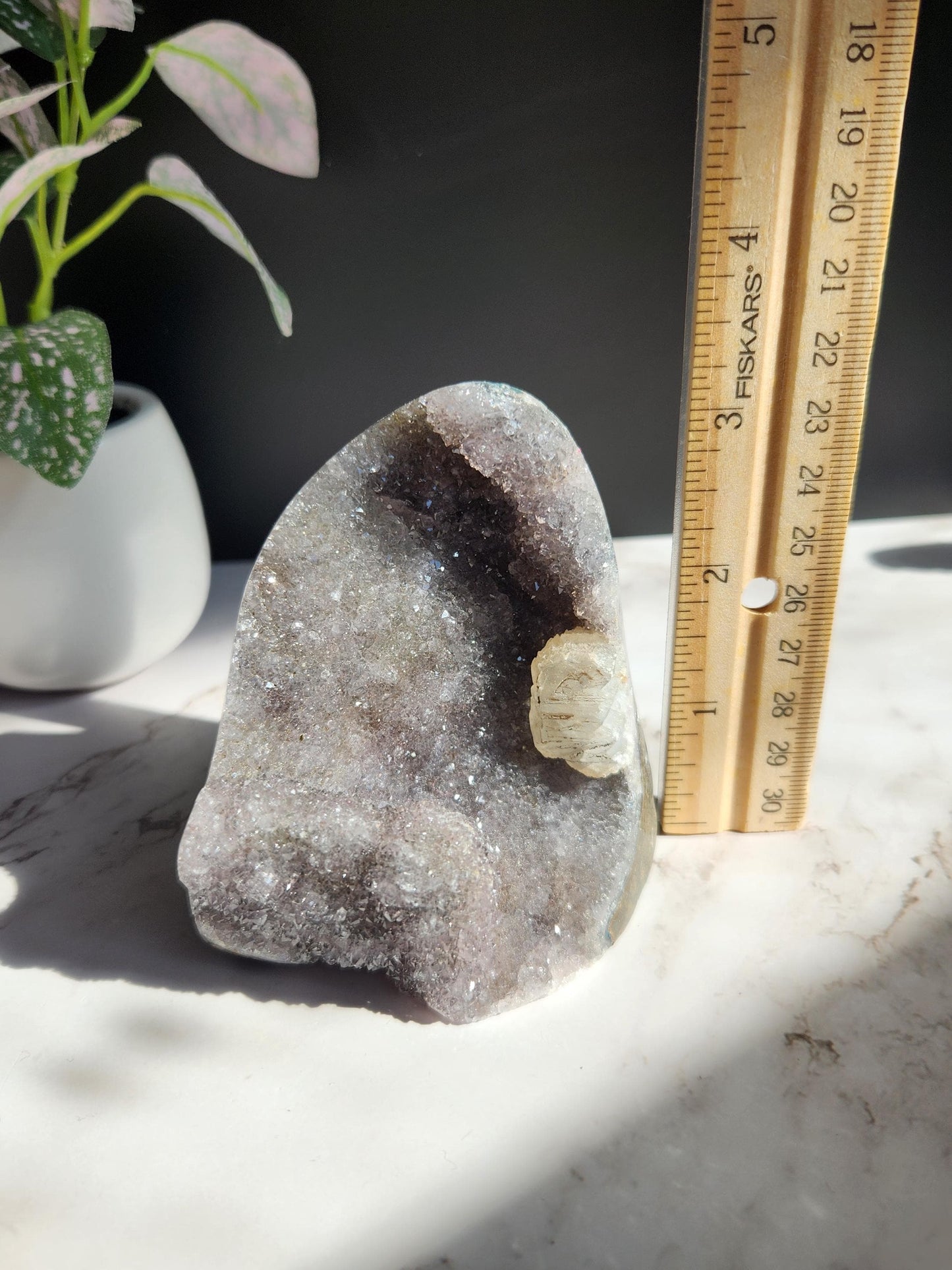 Lavender gray rainbow amethyst cutbase with calcite from Uruguay, natural color