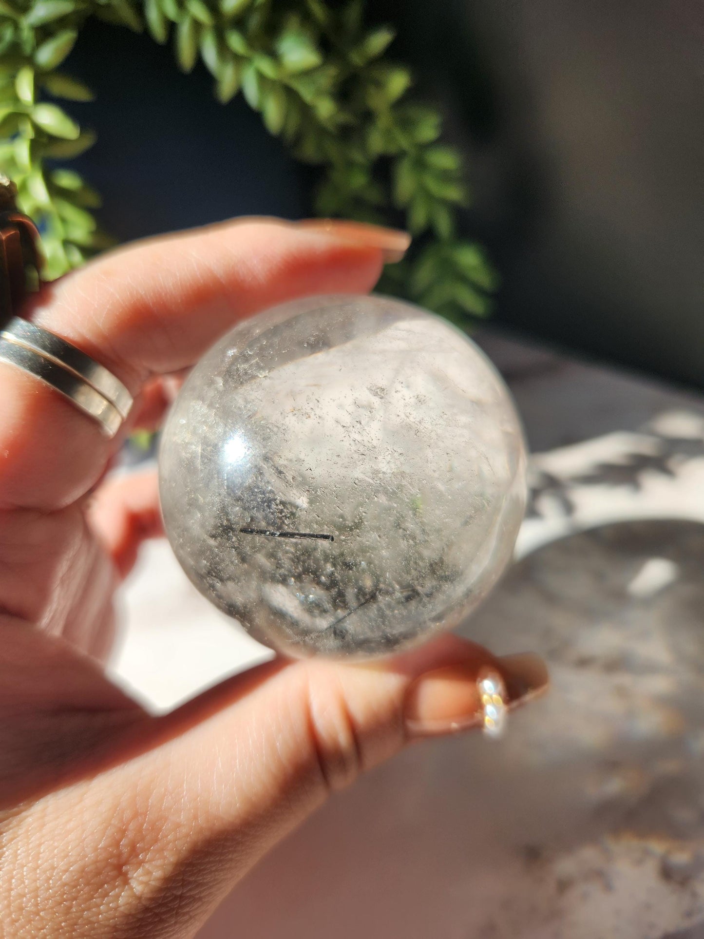 High quality black tourmaline in quartz sphere with rainbows.