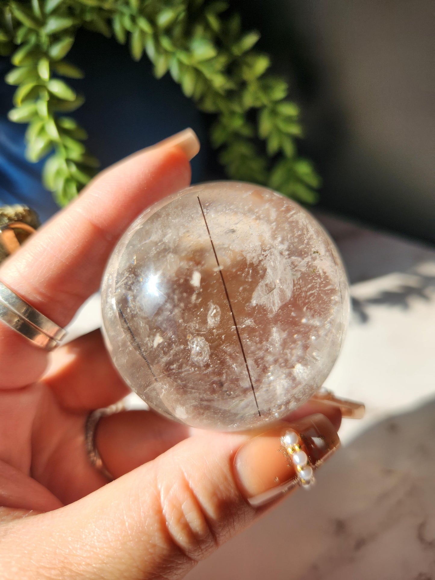 High quality black tourmaline in quartz sphere with rainbows.