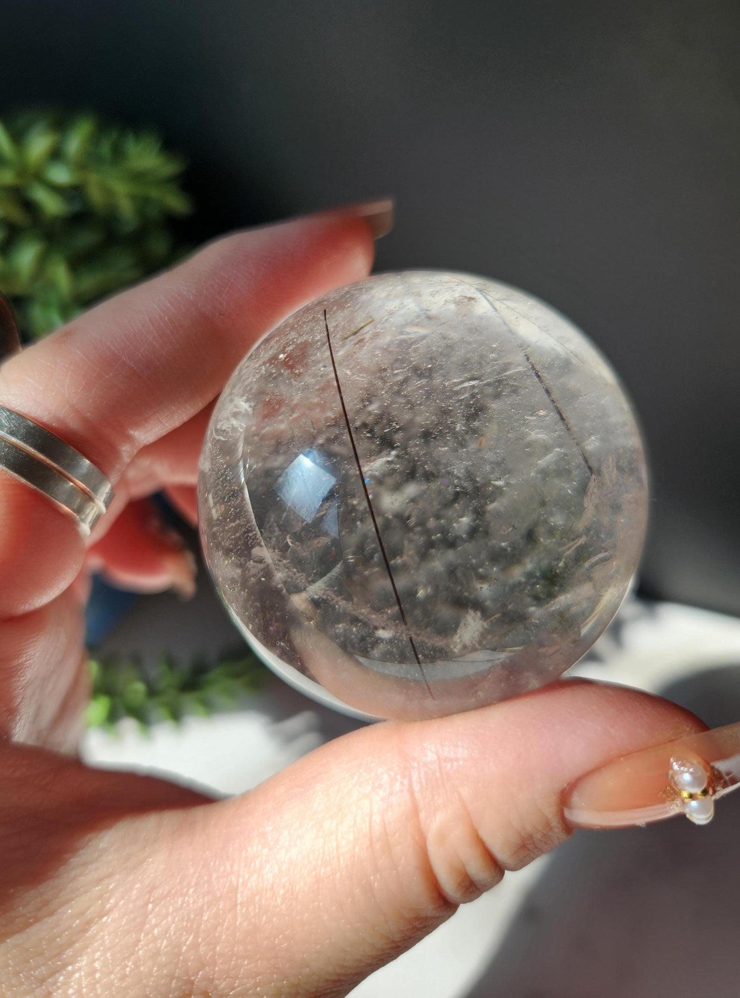 High quality black tourmaline in quartz sphere with rainbows.