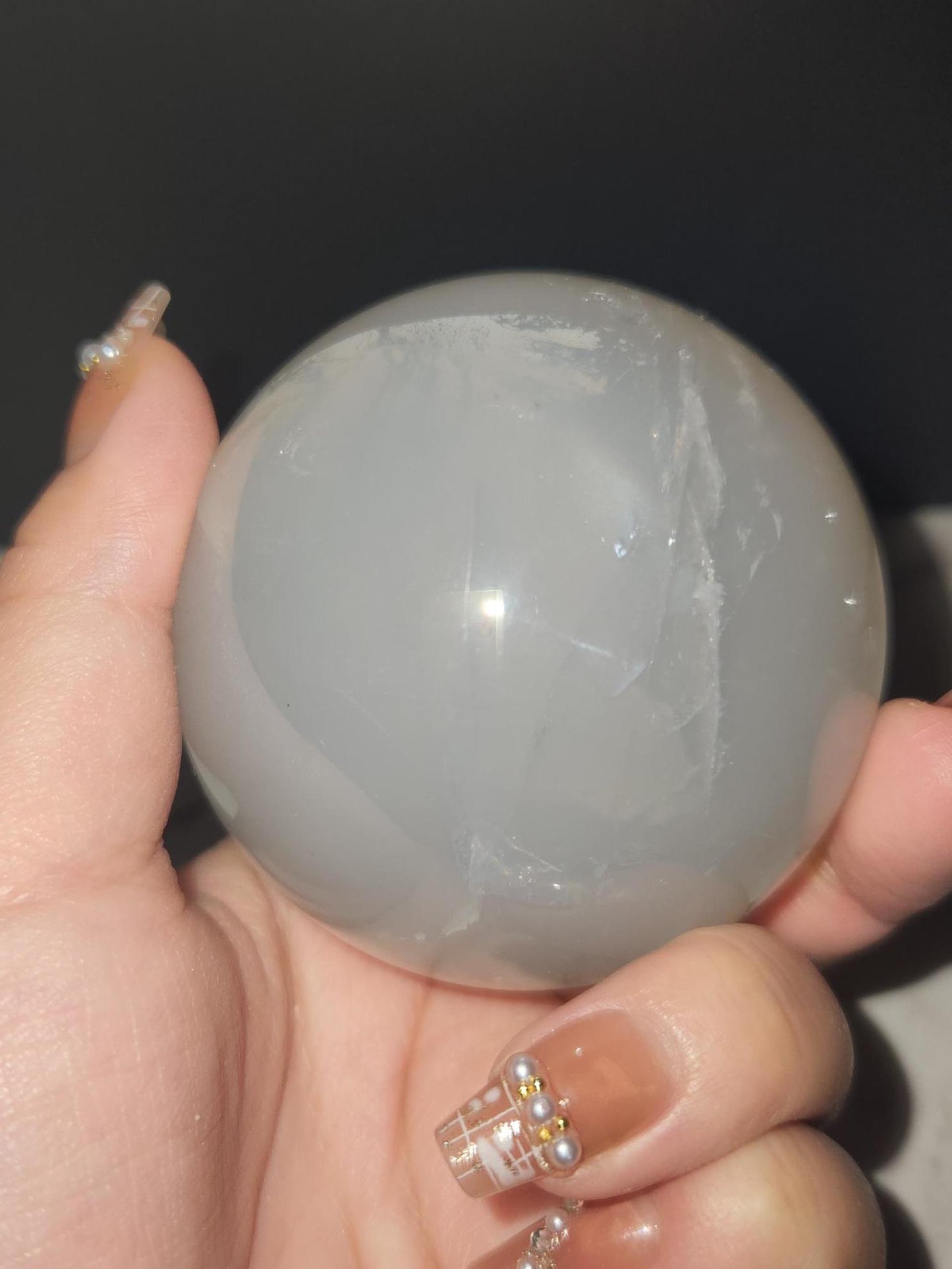Beautiful blue rose quartz sphere with inclusions and rainbows 67.2mm