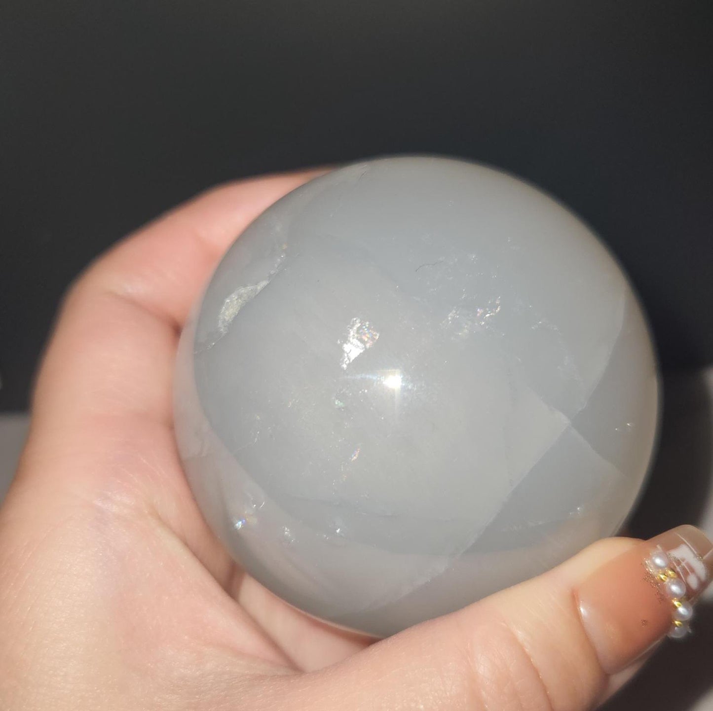 Beautiful blue rose quartz sphere with inclusions and rainbows 67.2mm