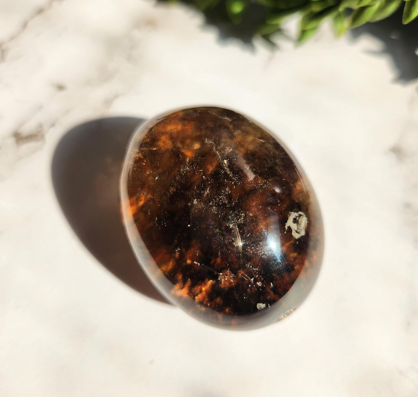 Natural smoky lodolite garden quartz lens from Brazil, half polish and half raw, with a beautiful rainbow