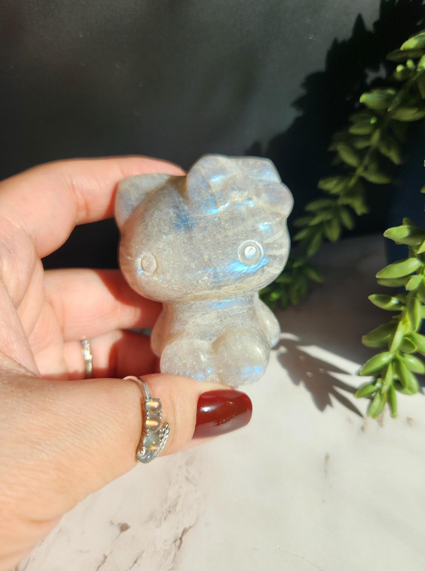 Beautiful blue moonstone hello kitty carving with amazing blue flash