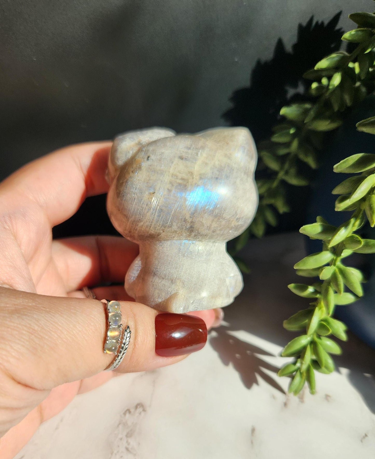 Beautiful blue moonstone hello kitty carving with amazing blue flash