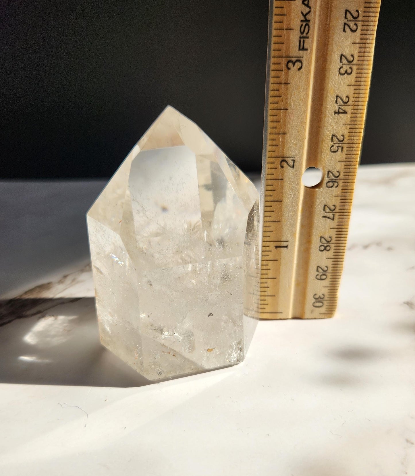 Beautiful high quality light smoky quartz tower with lots of rainbows and iron inclusions from Brazil