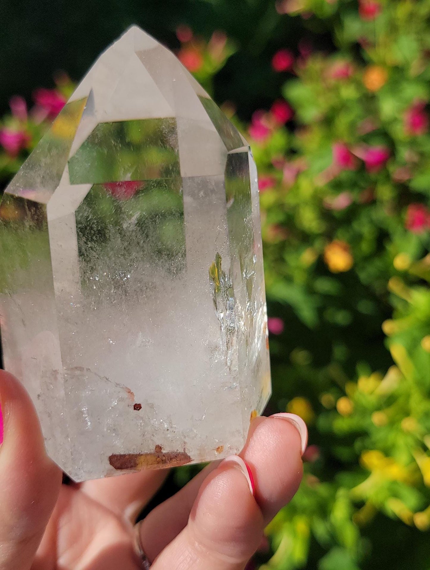 Beautiful high quality light smoky quartz tower with lots of rainbows and iron inclusions from Brazil