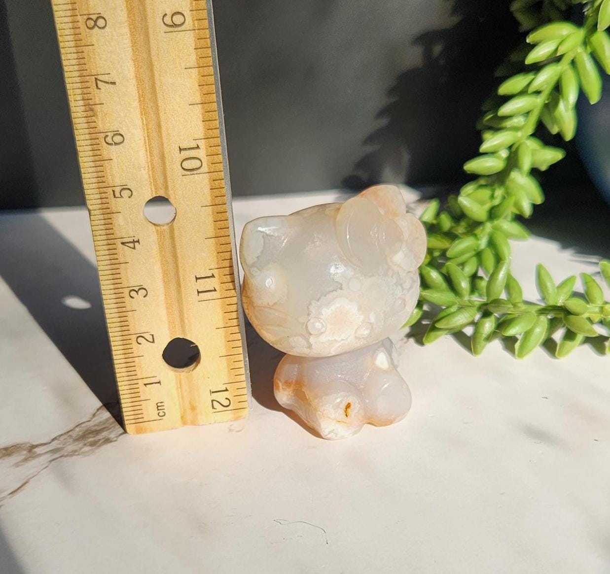 Beautiful flower agate hello kitty carving with a druzy, natural