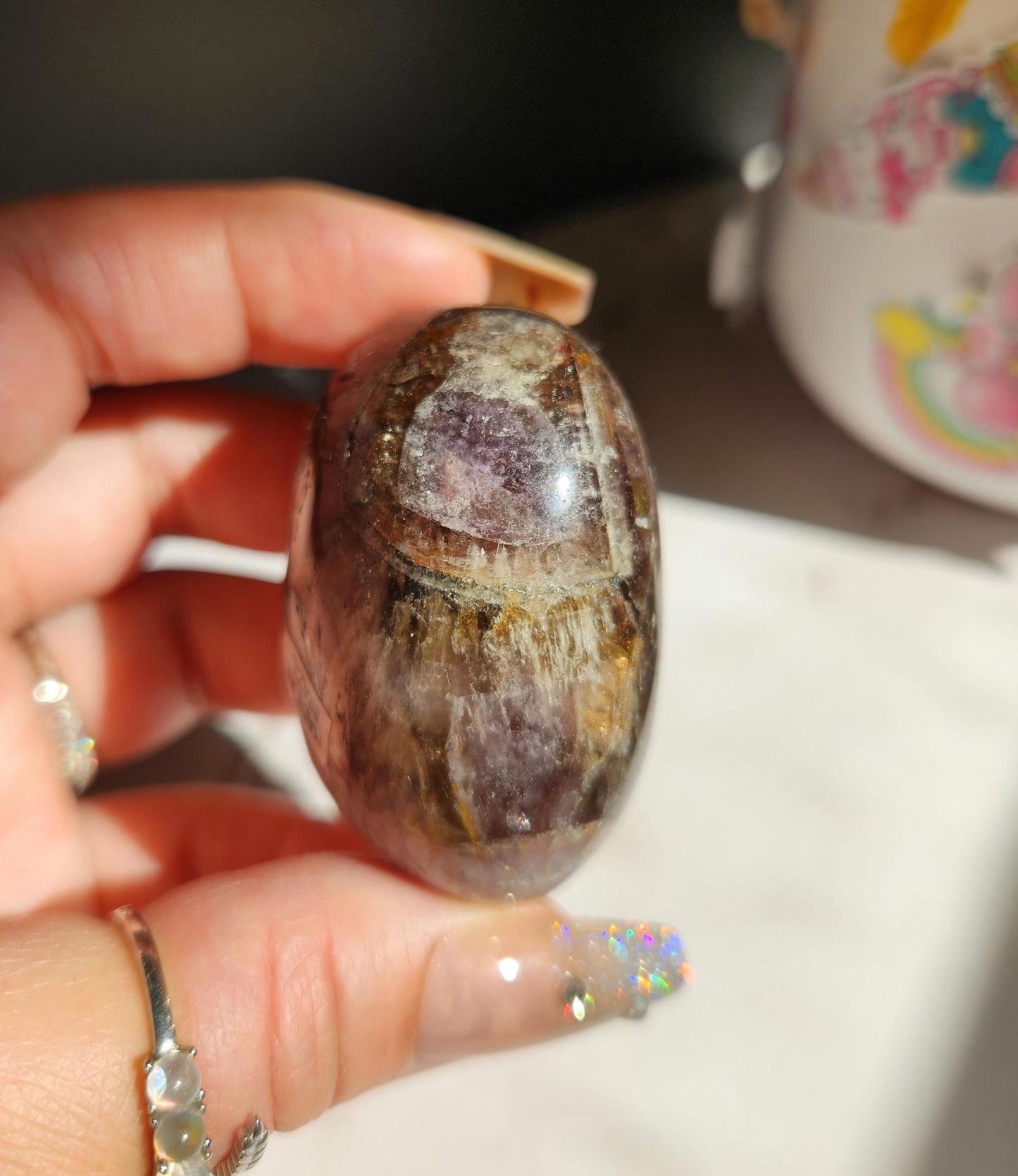 Rare natural super seven palm stone from Brazil 26D