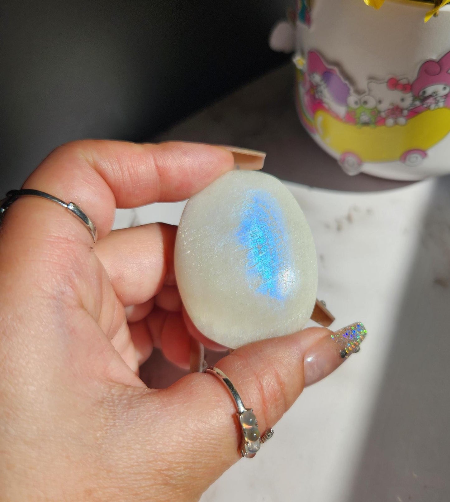 High quality blue moonstone palm stone with white and blue flash from Madagascar A24