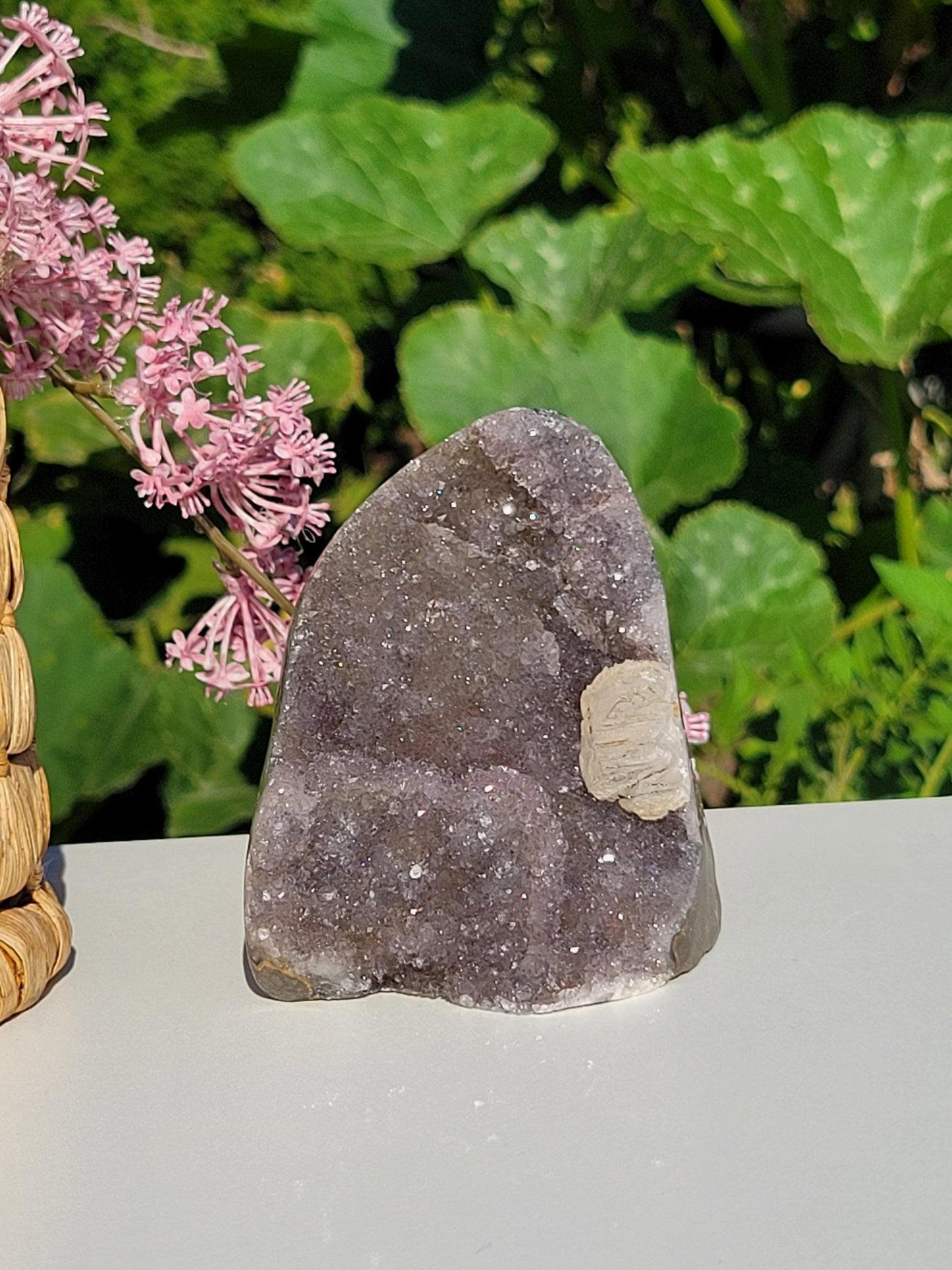 Lavender gray rainbow amethyst cutbase with calcite from Uruguay, natural color