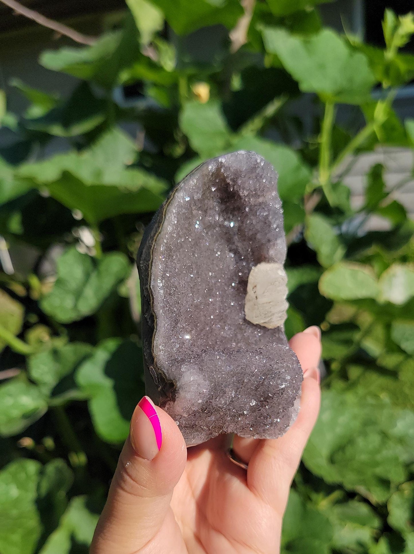 Lavender gray rainbow amethyst cutbase with calcite from Uruguay, natural color
