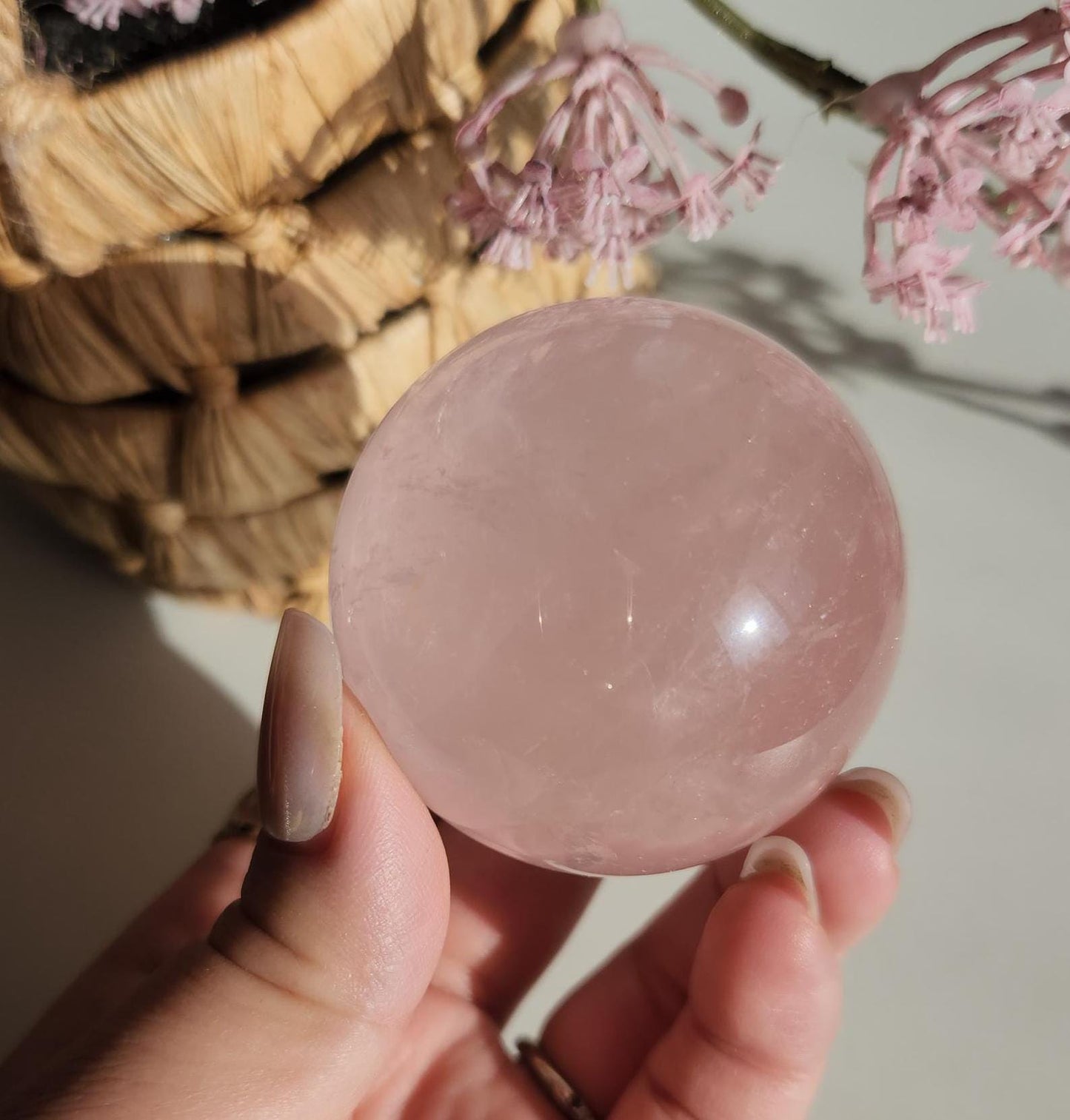 High quality 6 star rose quartz sphere, translucent with inclusions and rainbows from Mozambique  H50