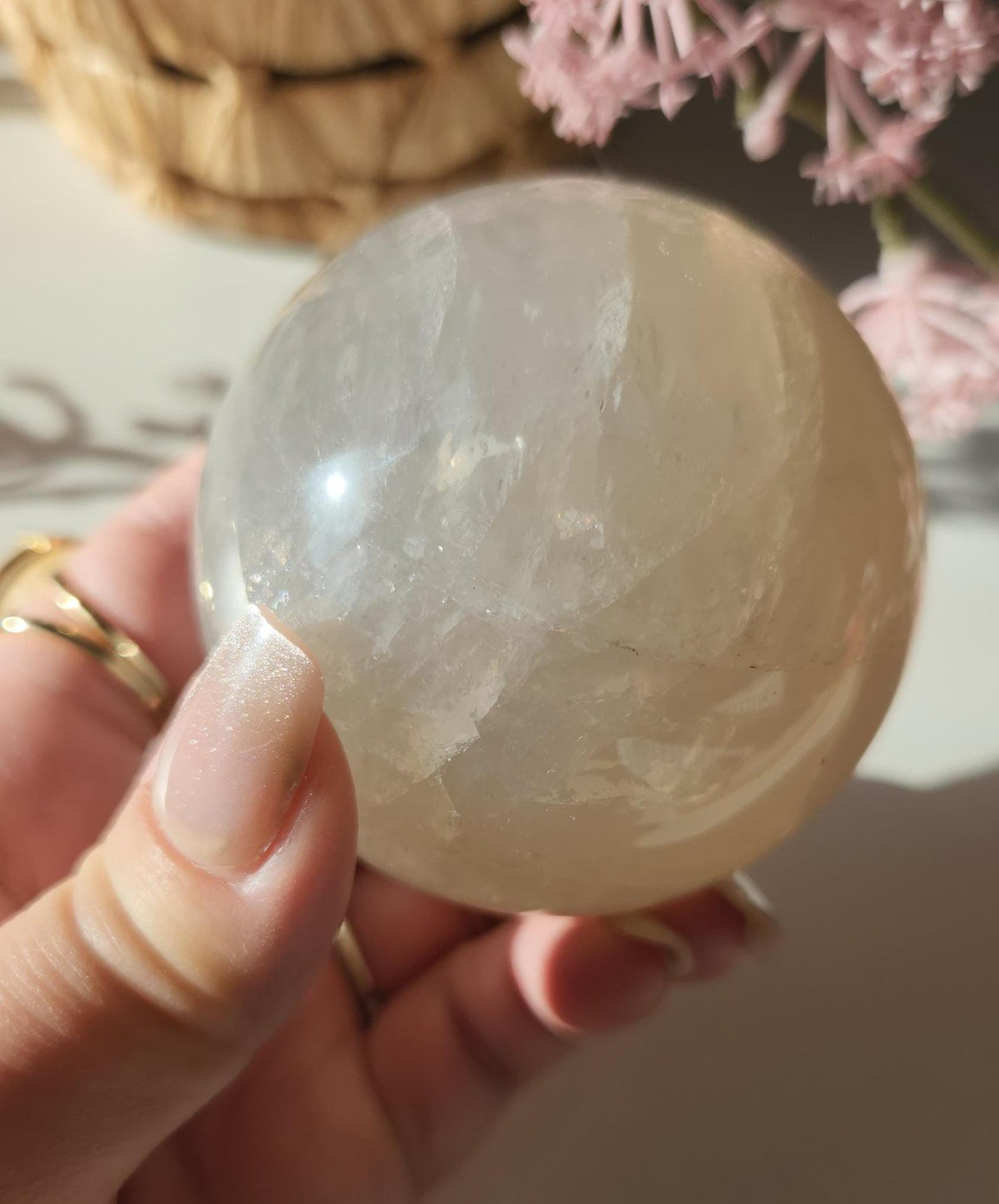 Beautiful blue rose quartz sphere with inclusions and rainbows