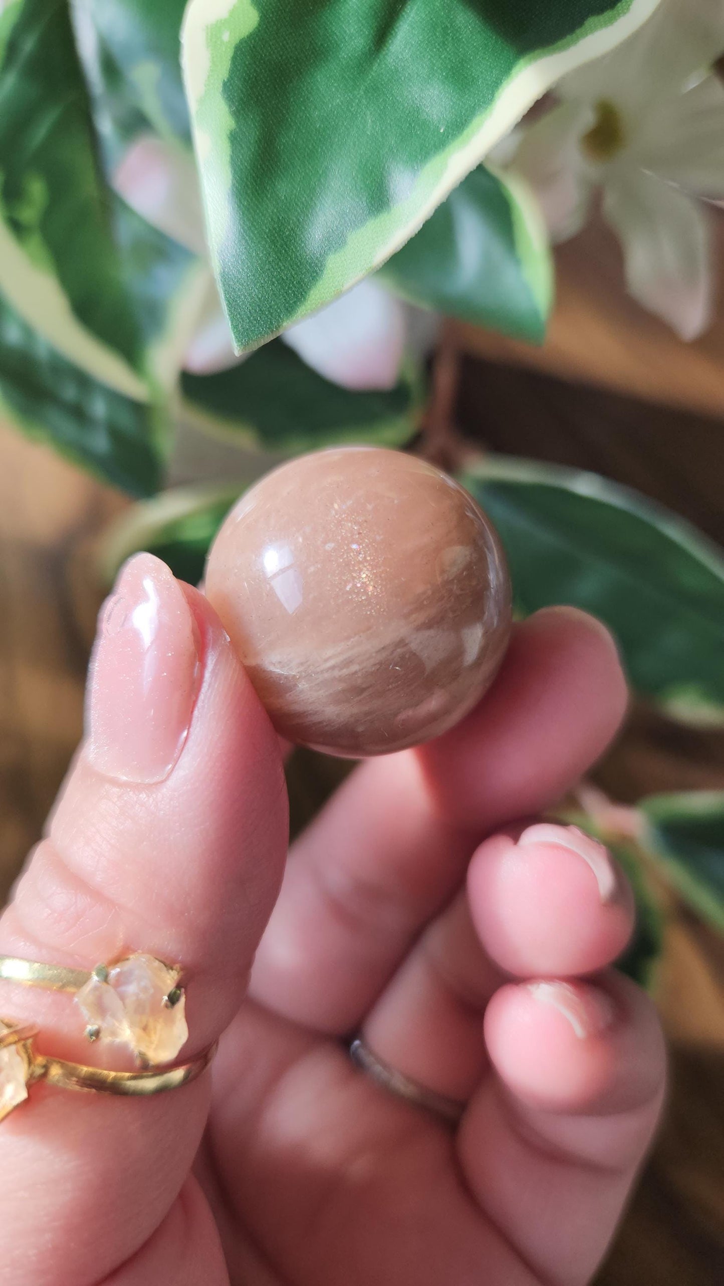 Pretty peach moonstone sphere with a nice flash