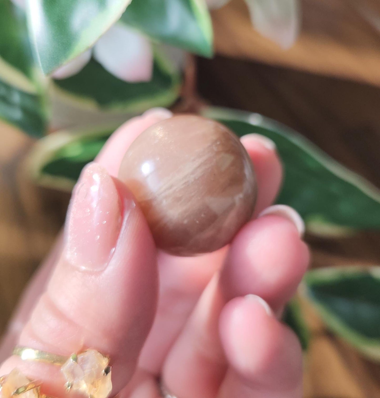 Pretty peach moonstone sphere with a nice flash