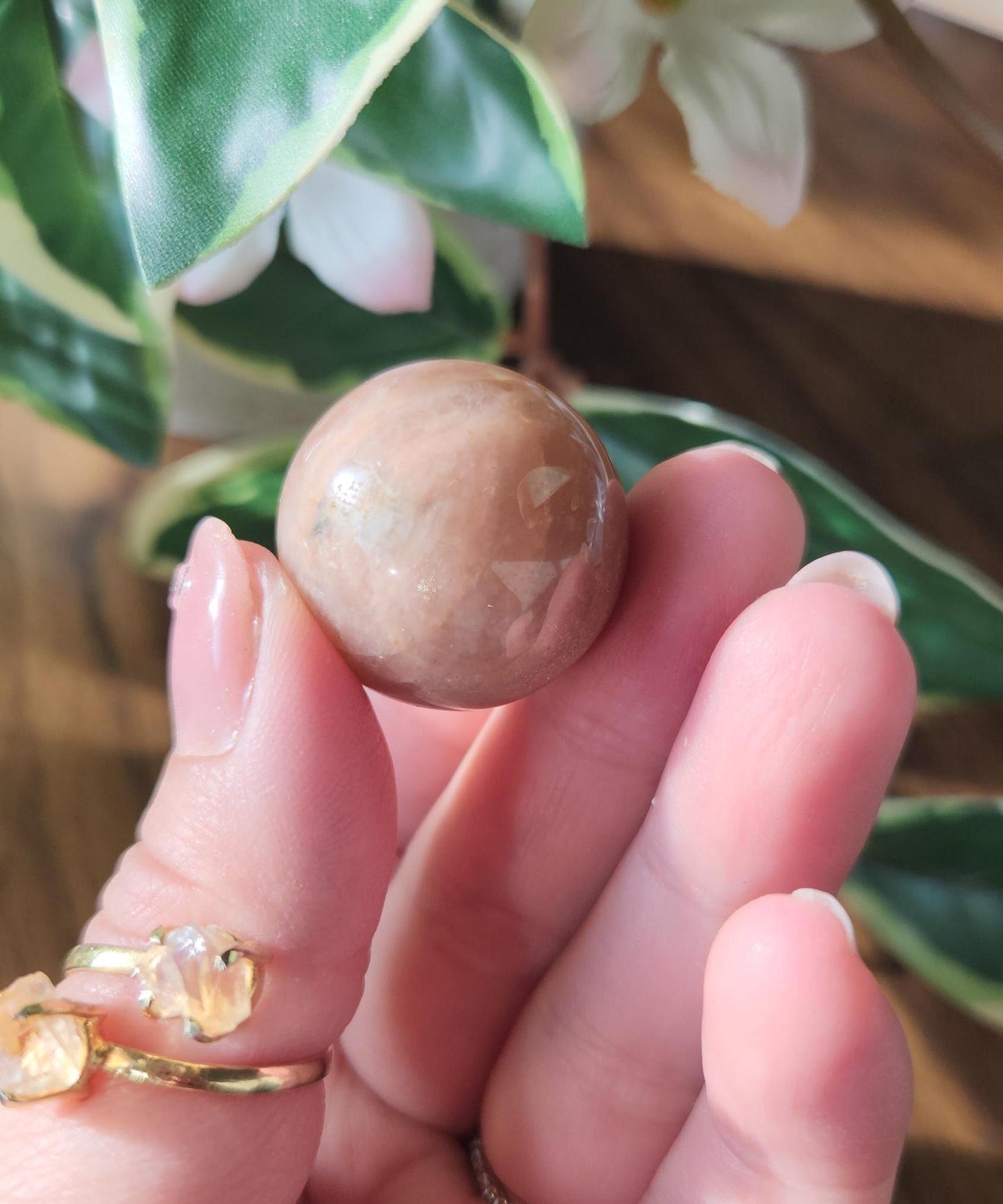 Pretty peach moonstone sphere with a nice flash