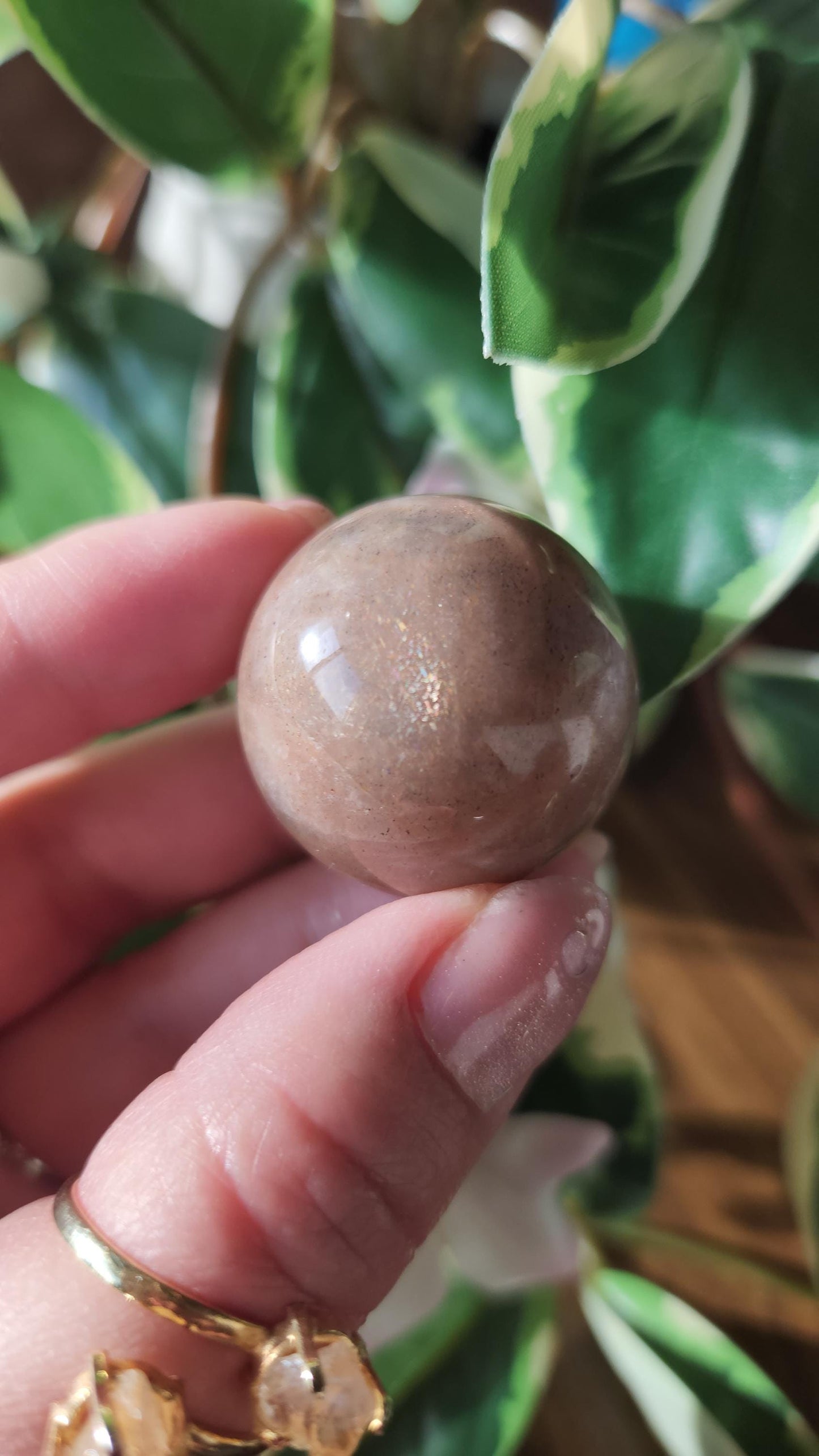 Beautiful peach moonstone sphere with a nice flash