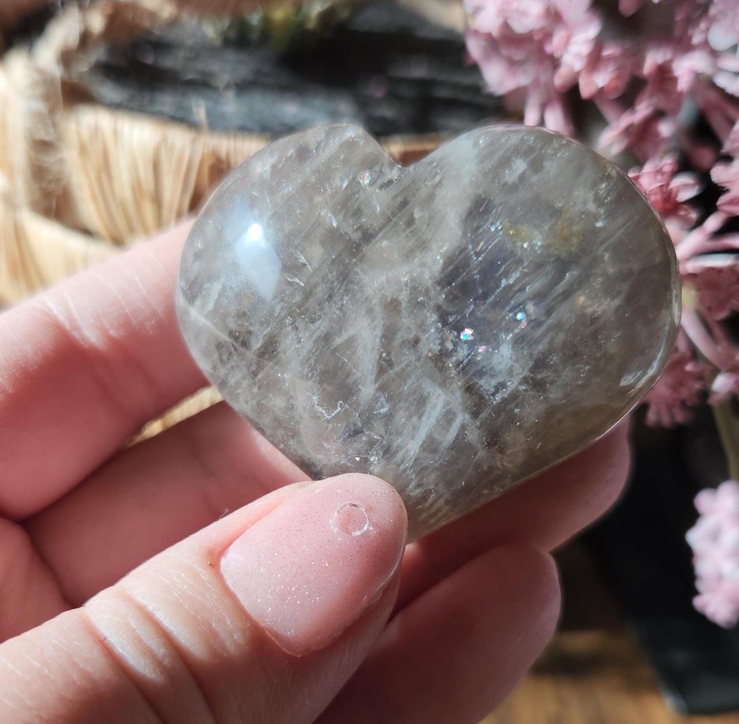 Pretty blue rose quartz heart with inclusions and rainbows