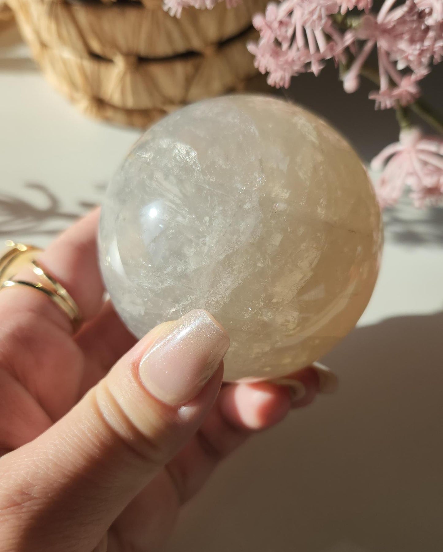 Beautiful blue rose quartz sphere with inclusions and rainbows