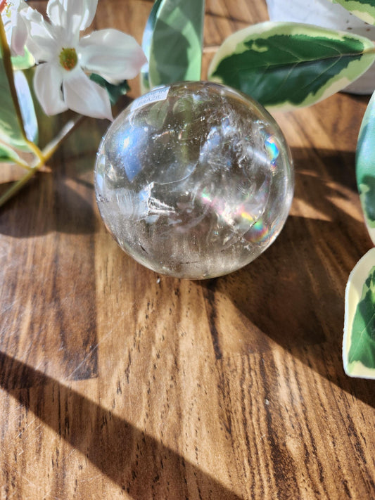 Amazing natural light smoky quartz sphere with beautiful rainbows and inclusions