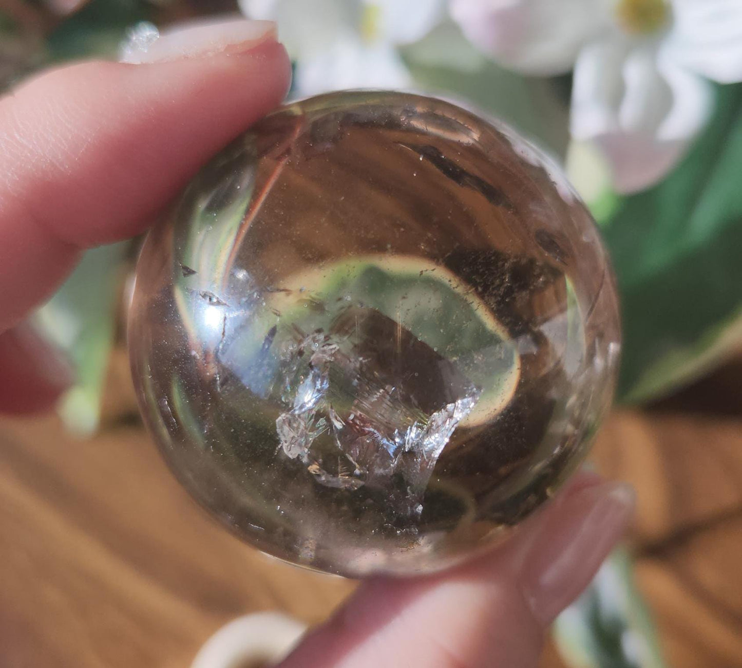 High quality natural smoky quartz sphere with many rainbows and inclusions 34A