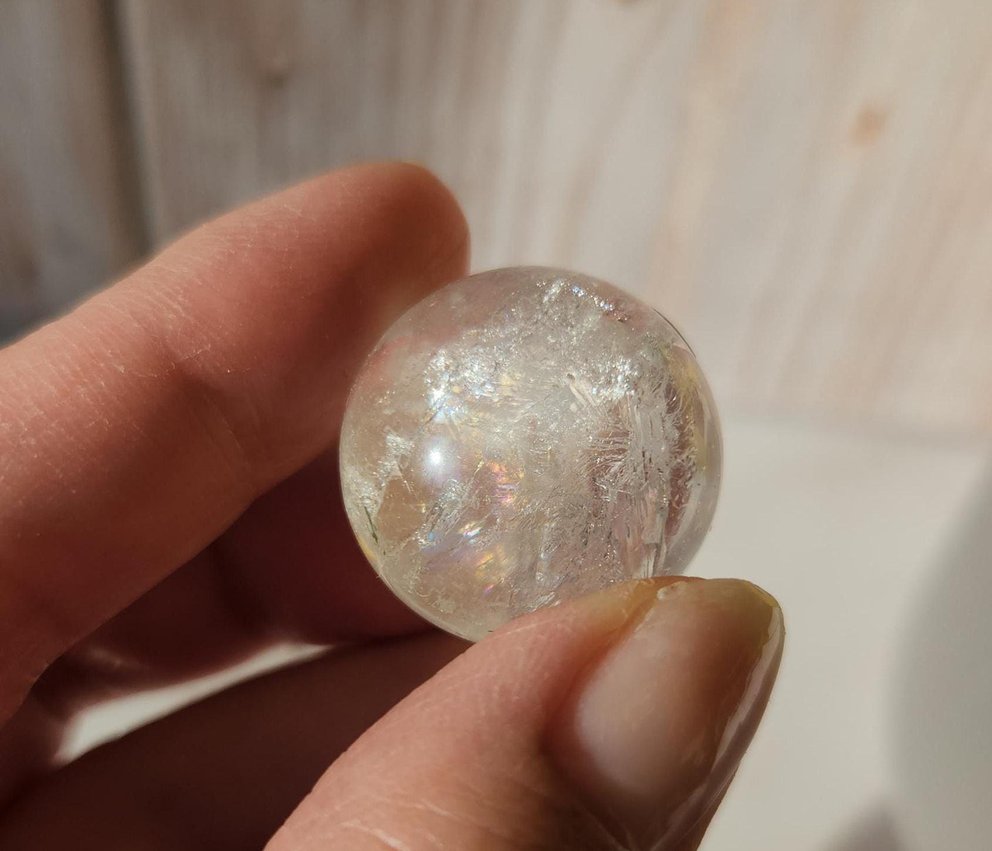 Rainbow clear quartz sphere with inclusions, from Brazil 22.5mm