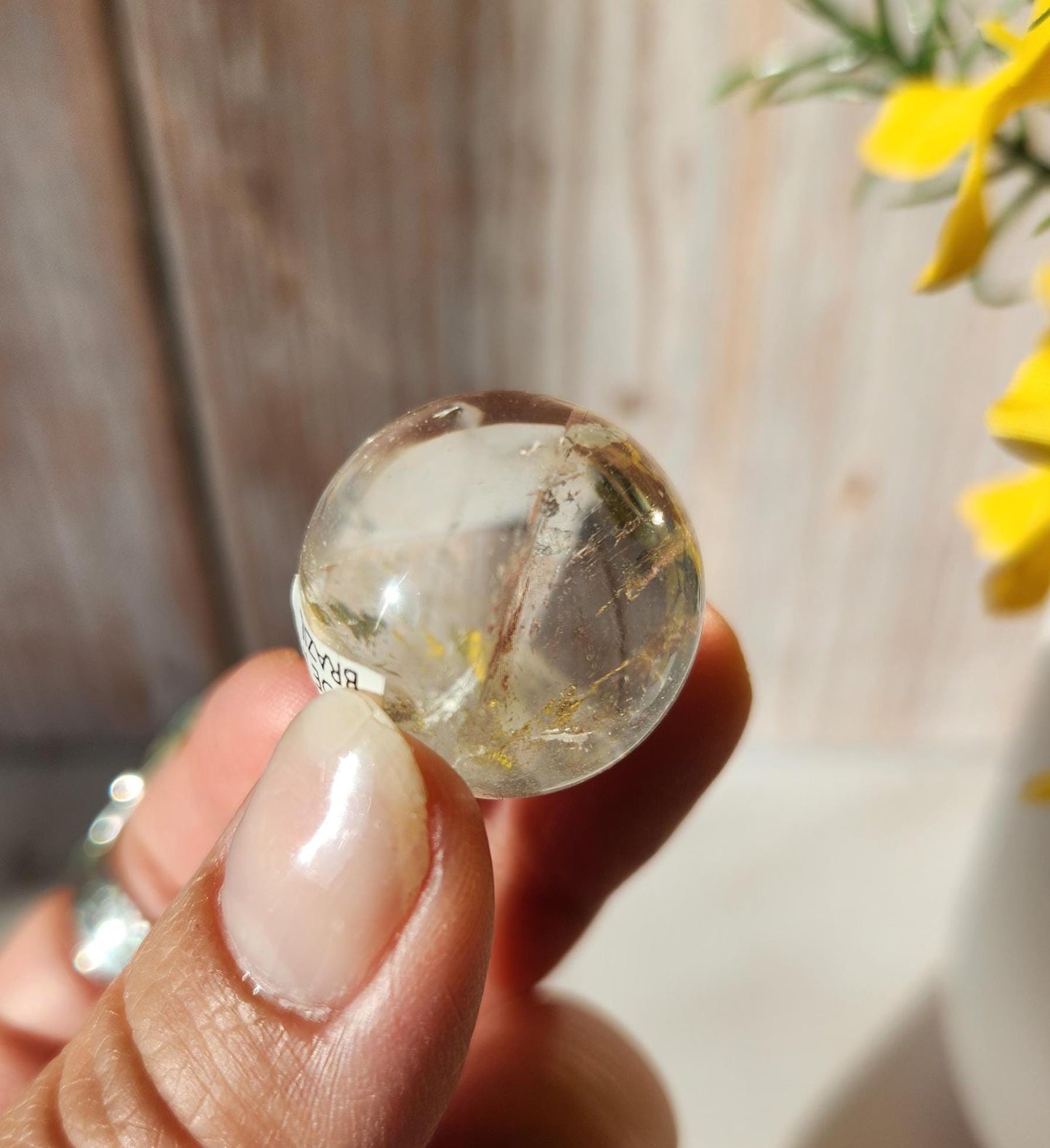 AAA Rainbow clear quartz sphere with inclusions, from Brazil 20.7mm