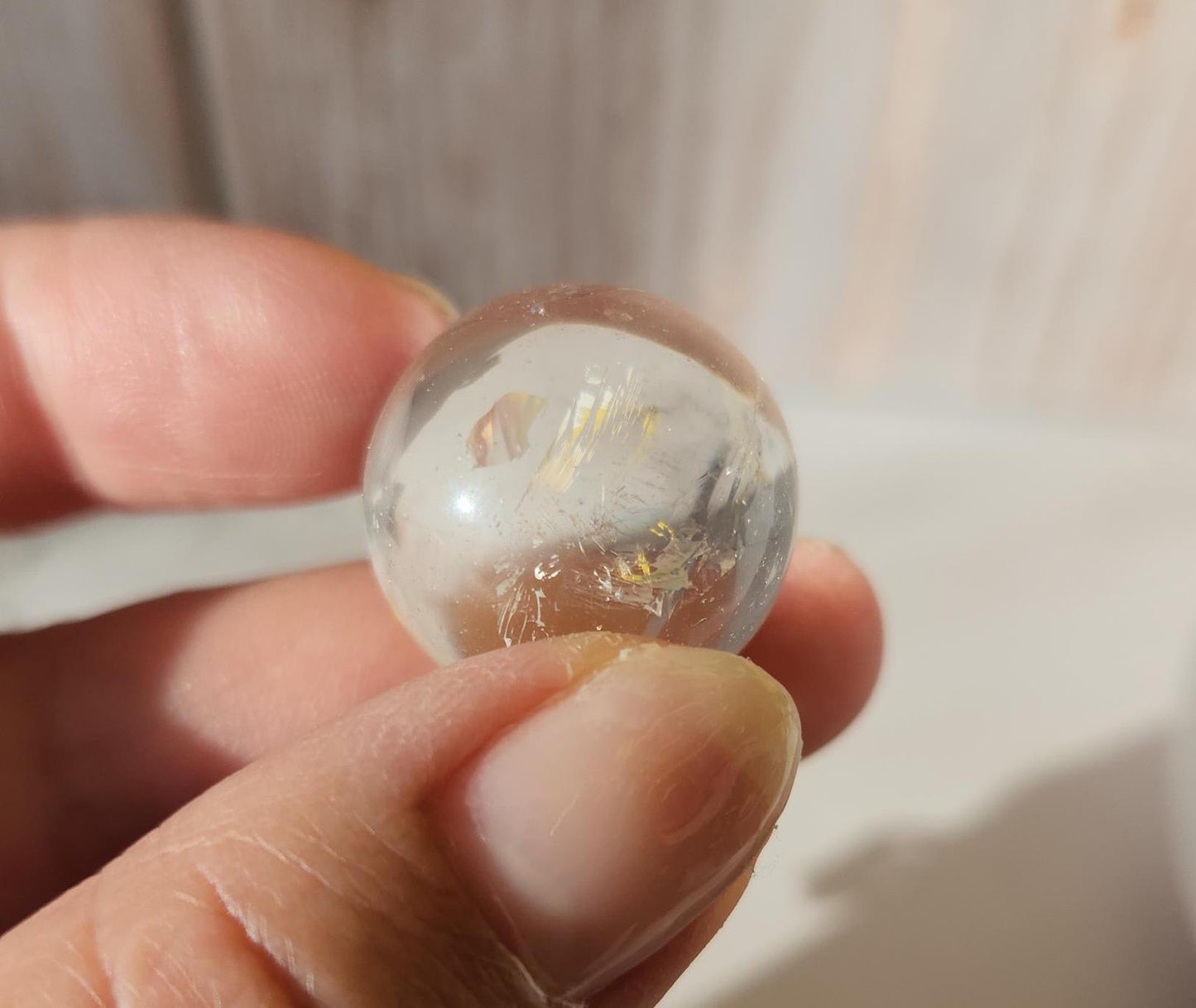 AAA Rainbow clear quartz sphere with inclusions, from Brazil 20.7mm