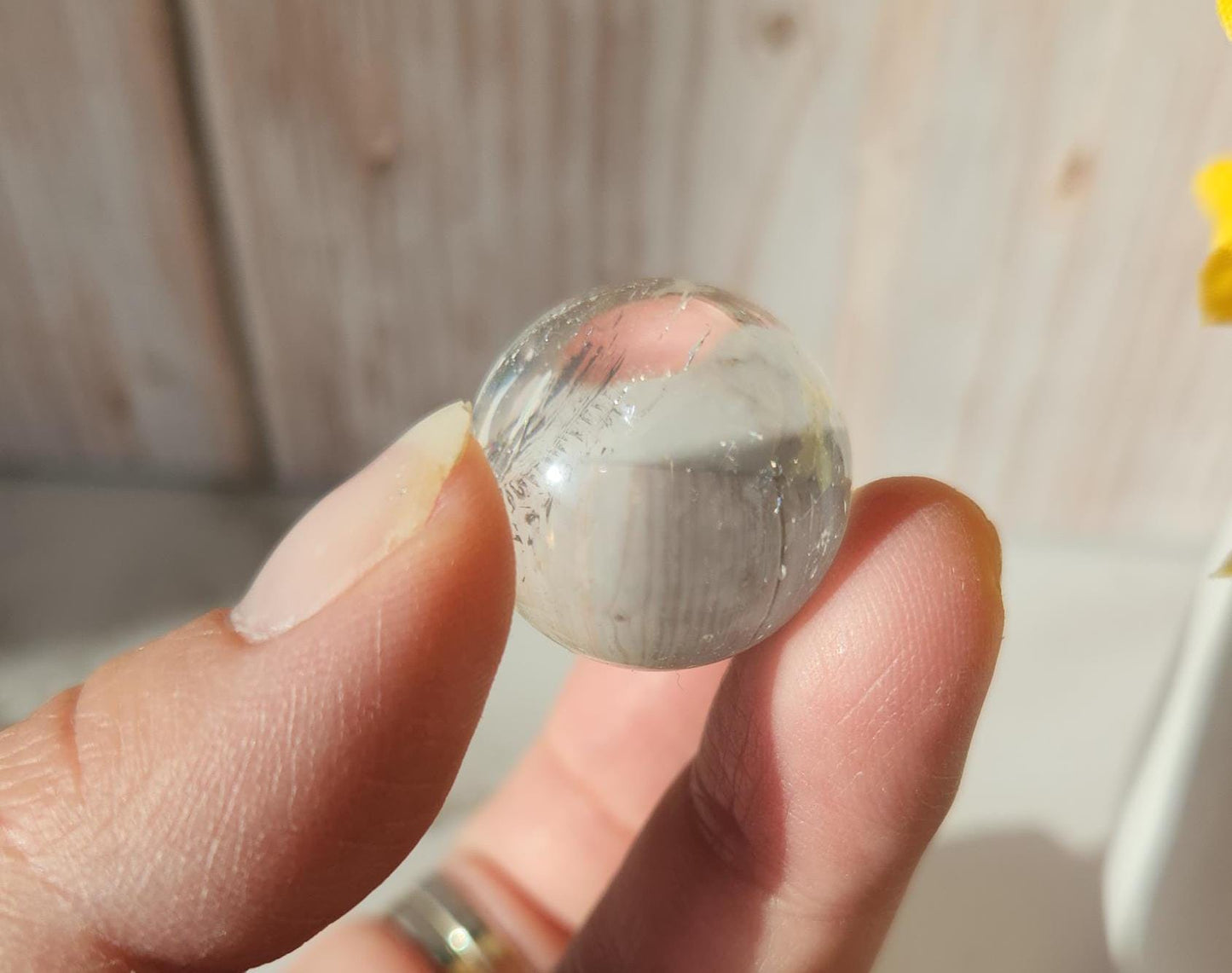 AAA Rainbow clear quartz sphere with inclusions, from Brazil 20.7mm