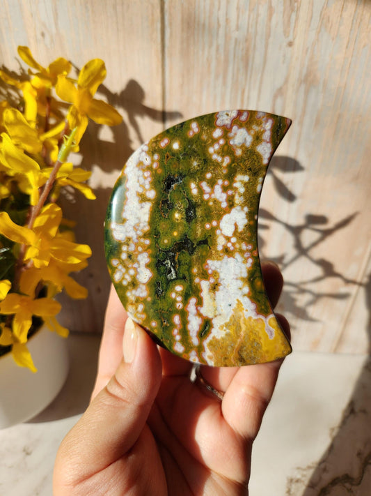 Large pink ocean jasper moon with beautiful colors, patterns, and druzy, stand included