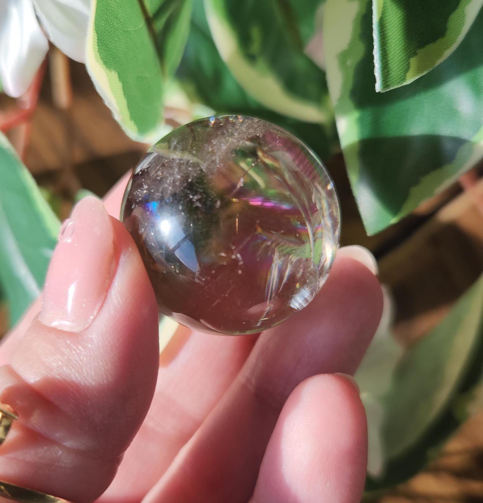 Light smoky quartz sphere with big rainbows