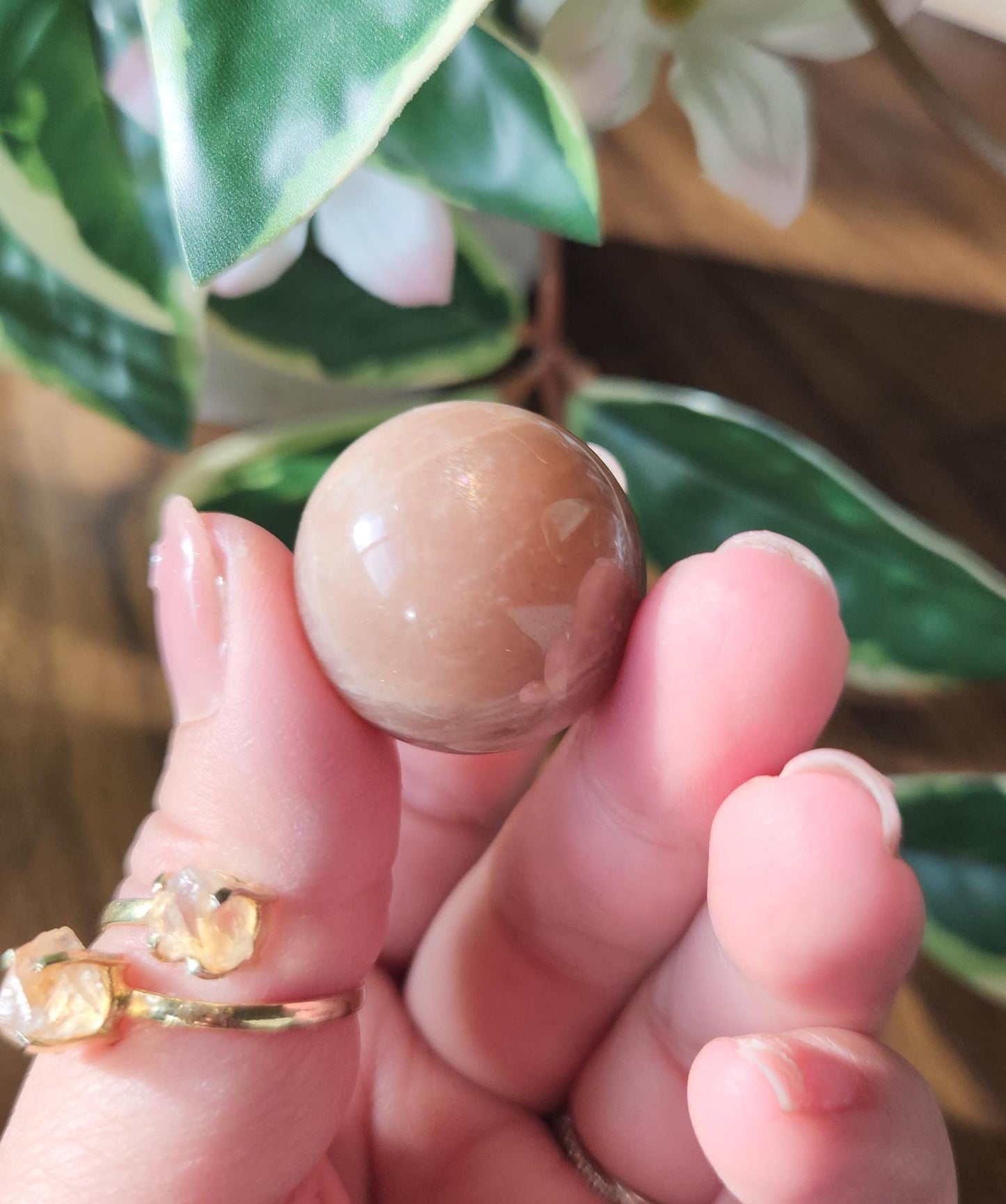 Pretty peach moonstone sphere with a nice flash