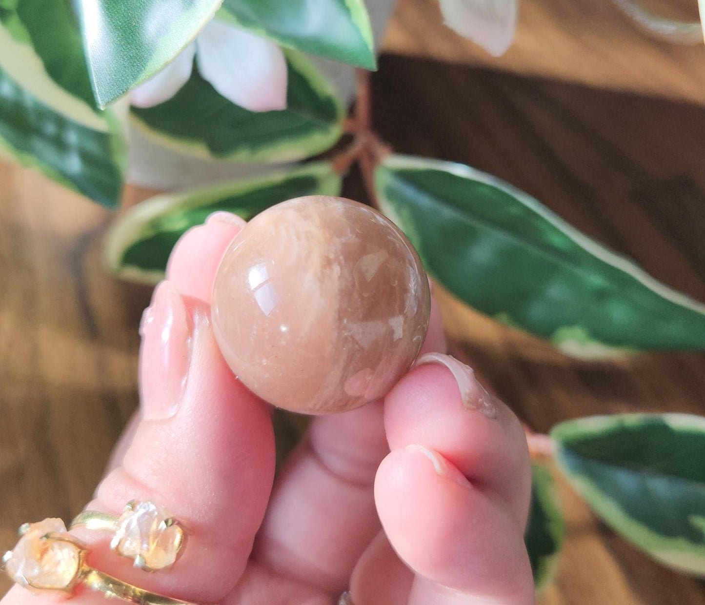 Pretty peach moonstone sphere with a nice flash
