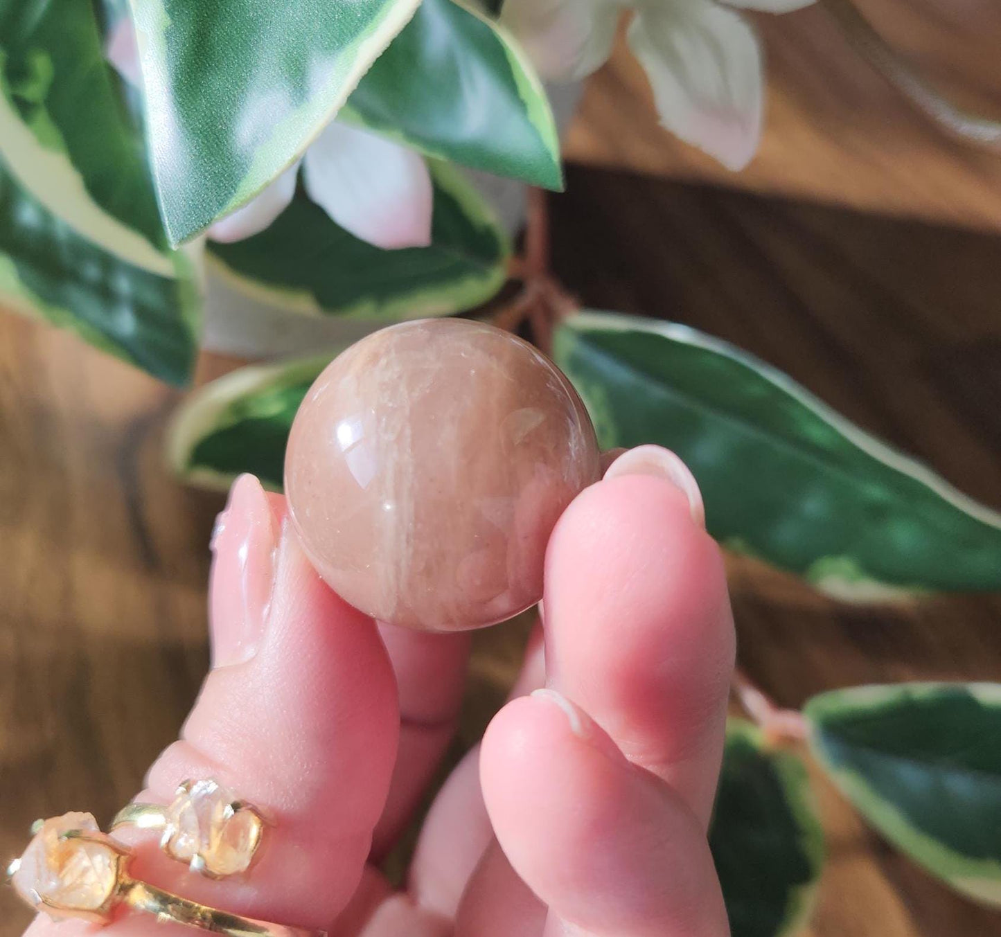 Pretty peach moonstone sphere with a nice flash