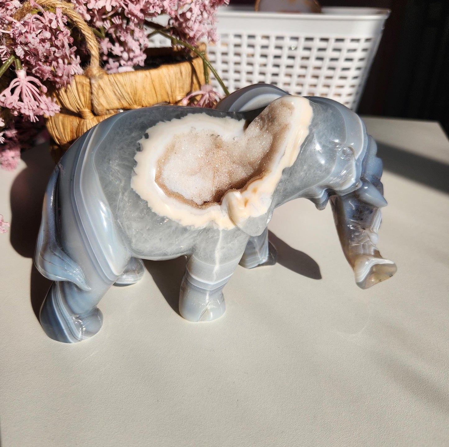 Beautiful master hand carved elephant agate with a sparkly white druzy, natural, nice banding, quartz