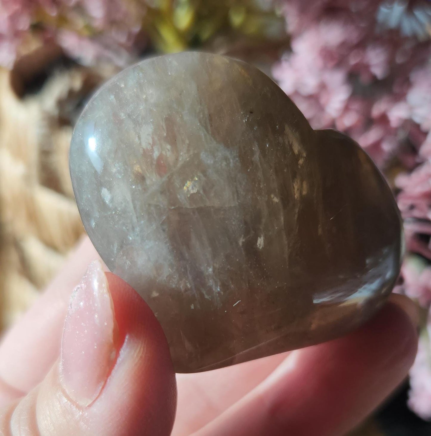 Pretty blue rose quartz heart with inclusions and rainbows