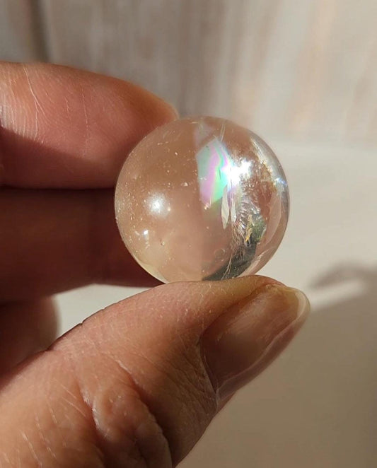 AAA Rainbow clear quartz sphere with inclusions, from Brazil 20.7mm