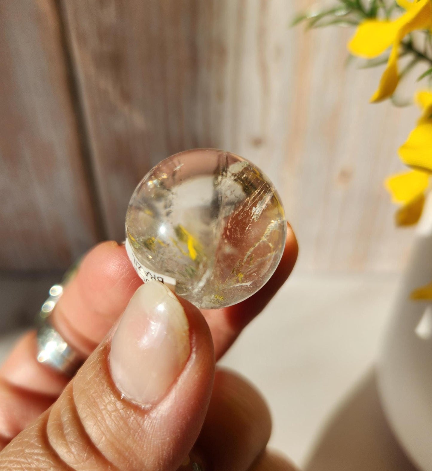 AAA Rainbow clear quartz sphere with inclusions, from Brazil 20.7mm