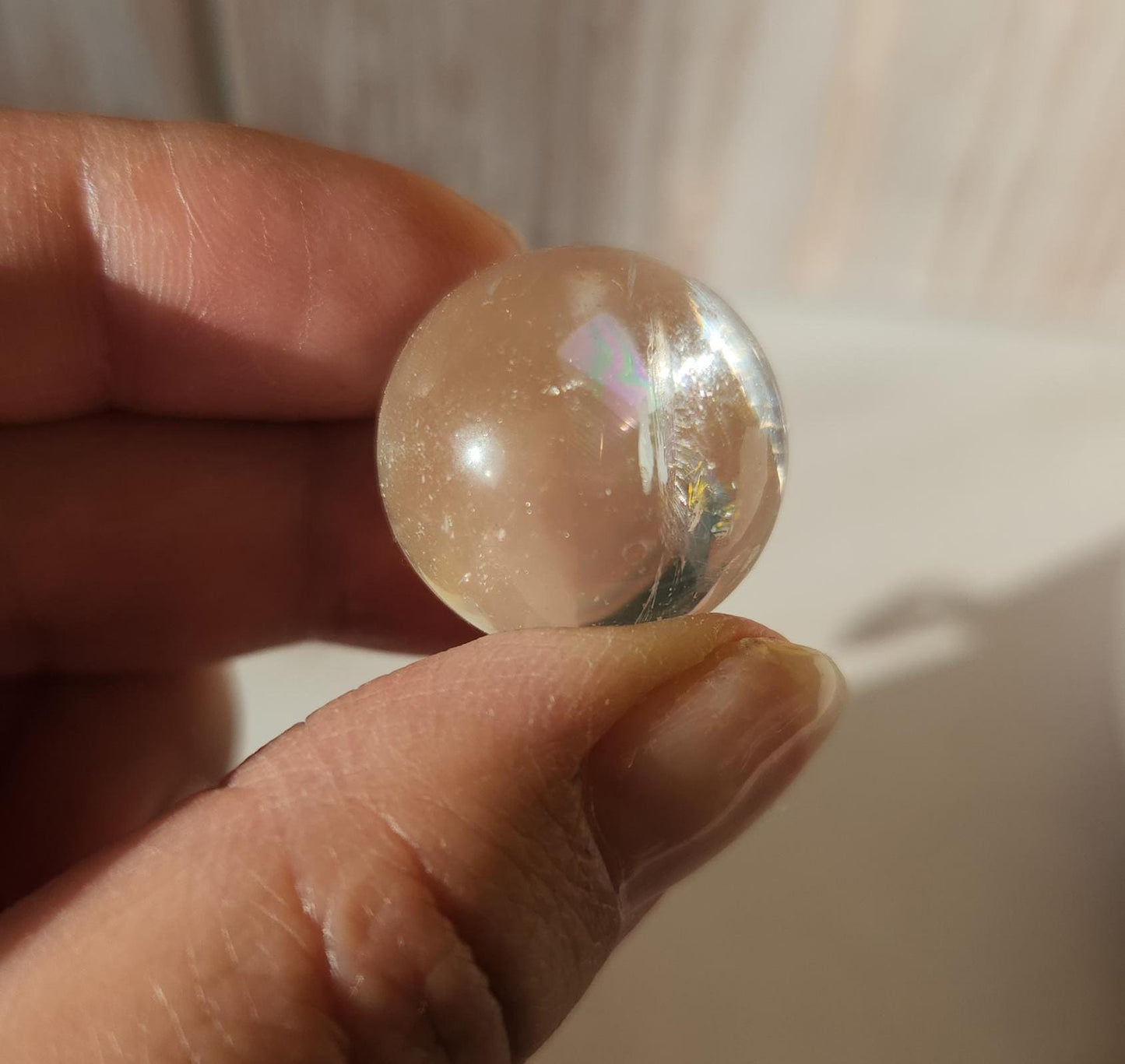 AAA Rainbow clear quartz sphere with inclusions, from Brazil 20.7mm
