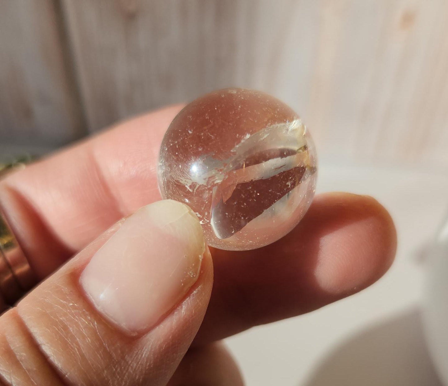 AAA Rainbow clear quartz sphere with inclusions, from Brazil 20.7mm