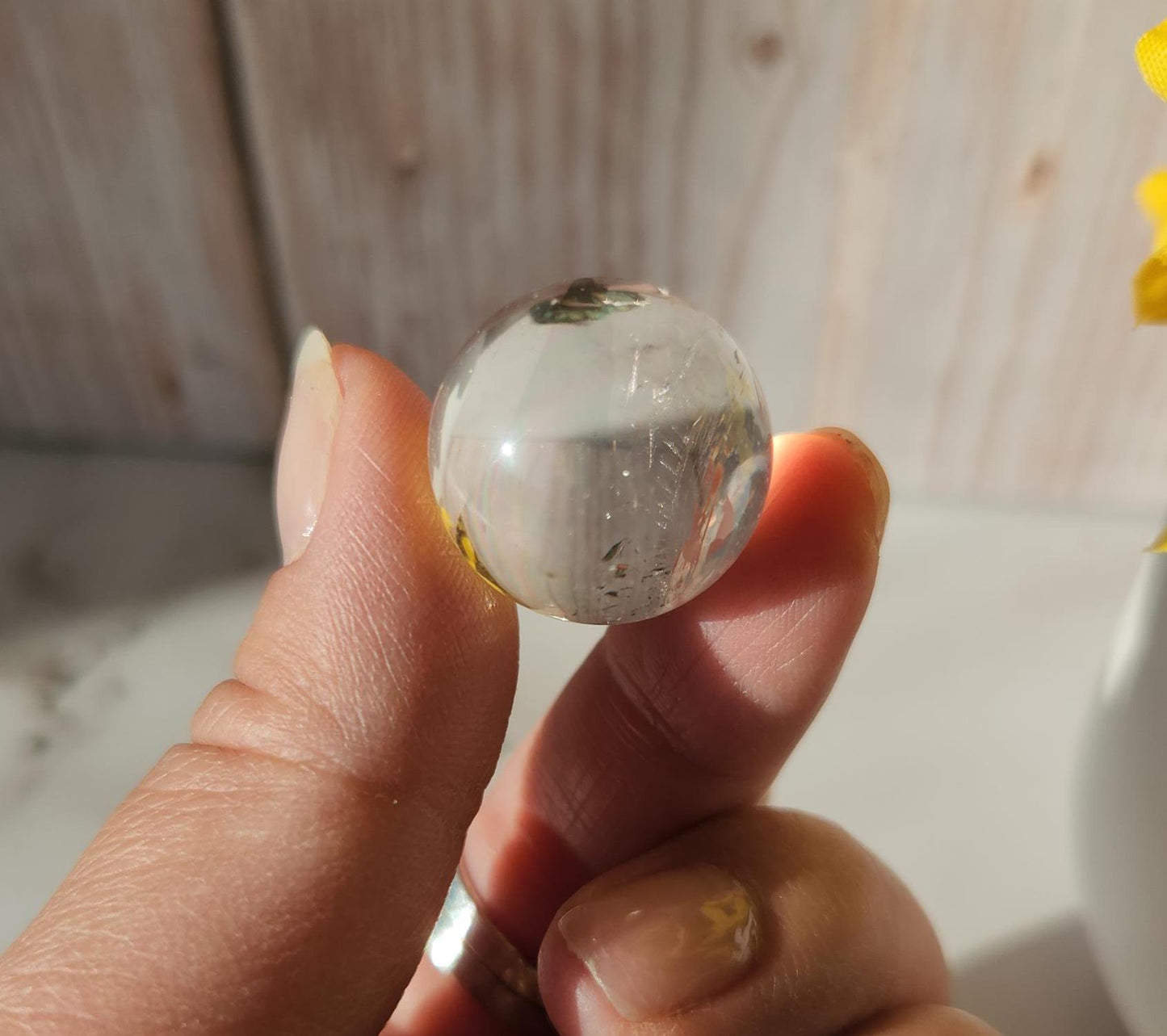 AAA Rainbow clear quartz sphere with inclusions, from Brazil 20.7mm