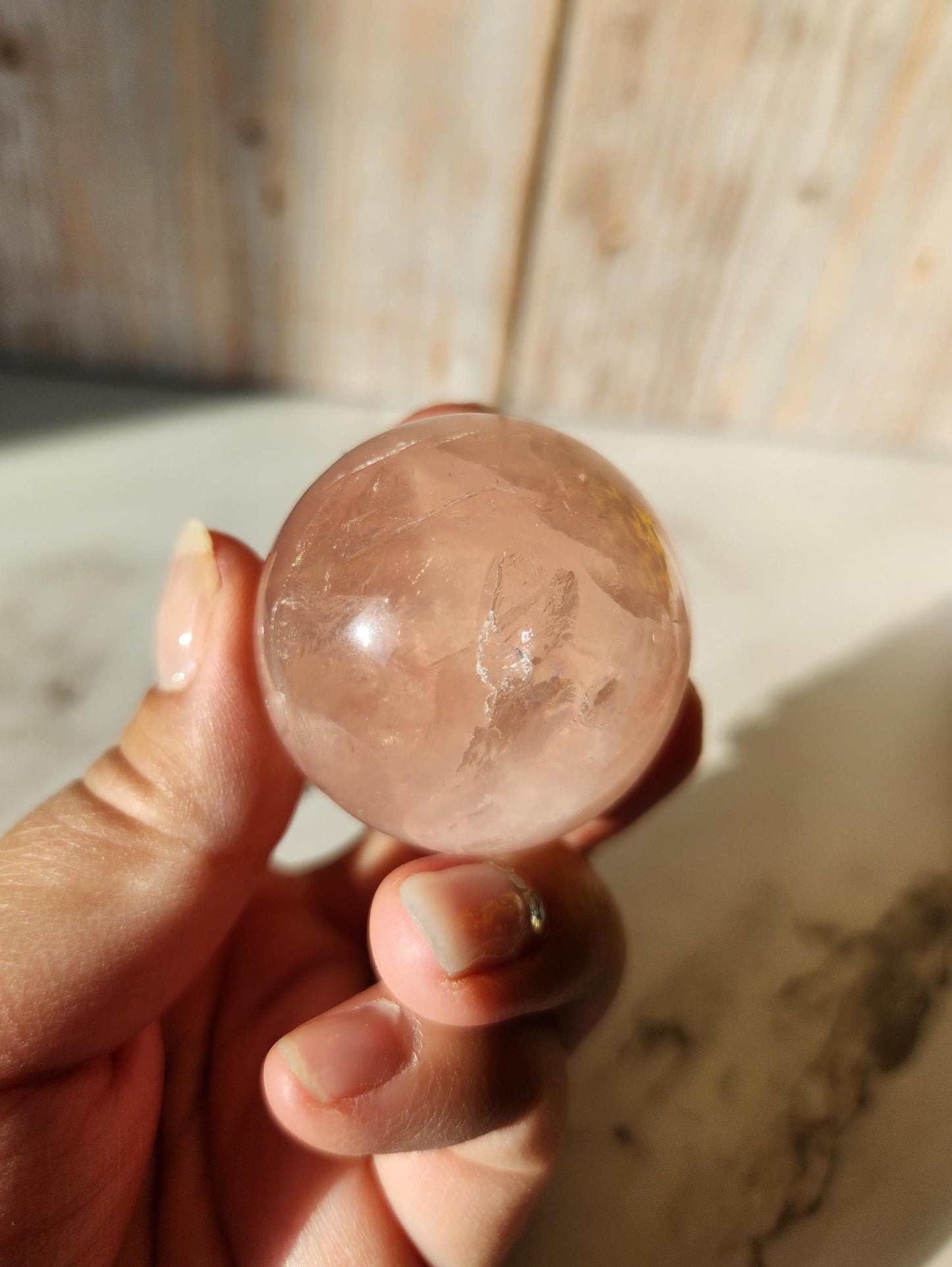 Juicy rose quartz sphere with inclusions, rainbows, and asterism from Brazil  38.5mm
