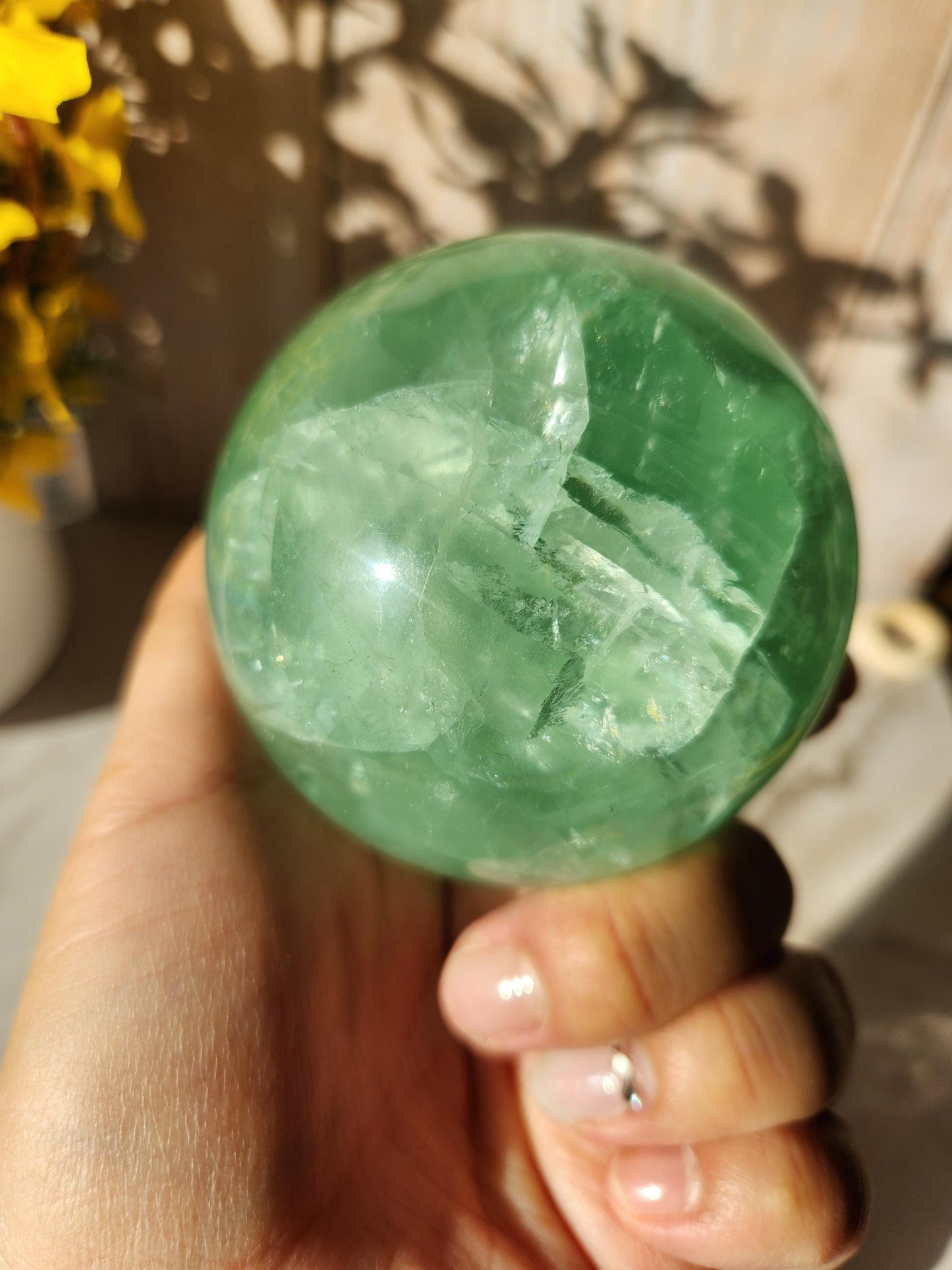 Beautiful large natural green fluorite sphere with many rainbows and inclusions 73.4mm