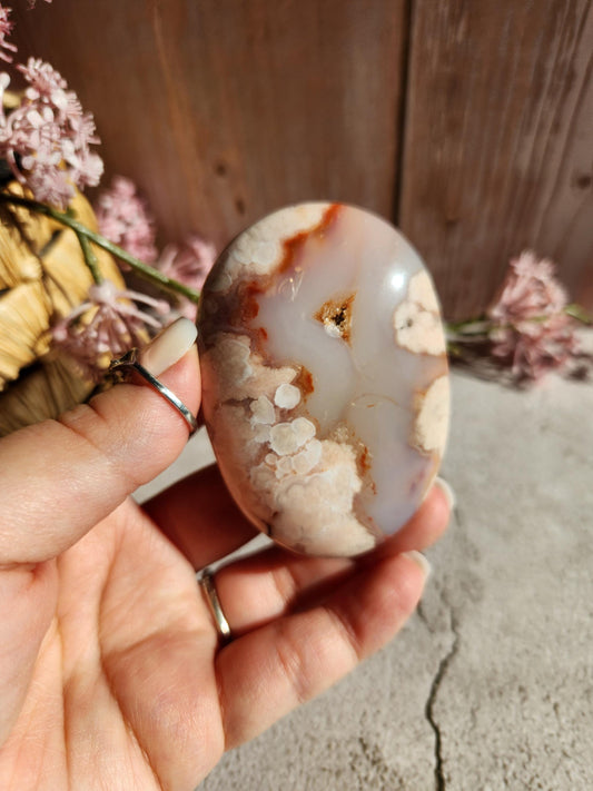 Beautiful natural carnelian flower agate palm stone with flowers, druzy and agate banding from Madagascar, cherry blossoms