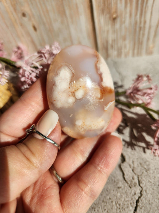 Beautiful natural carnelian flower agate palm stone with sparkly flowers from Madagascar, cherry blossoms