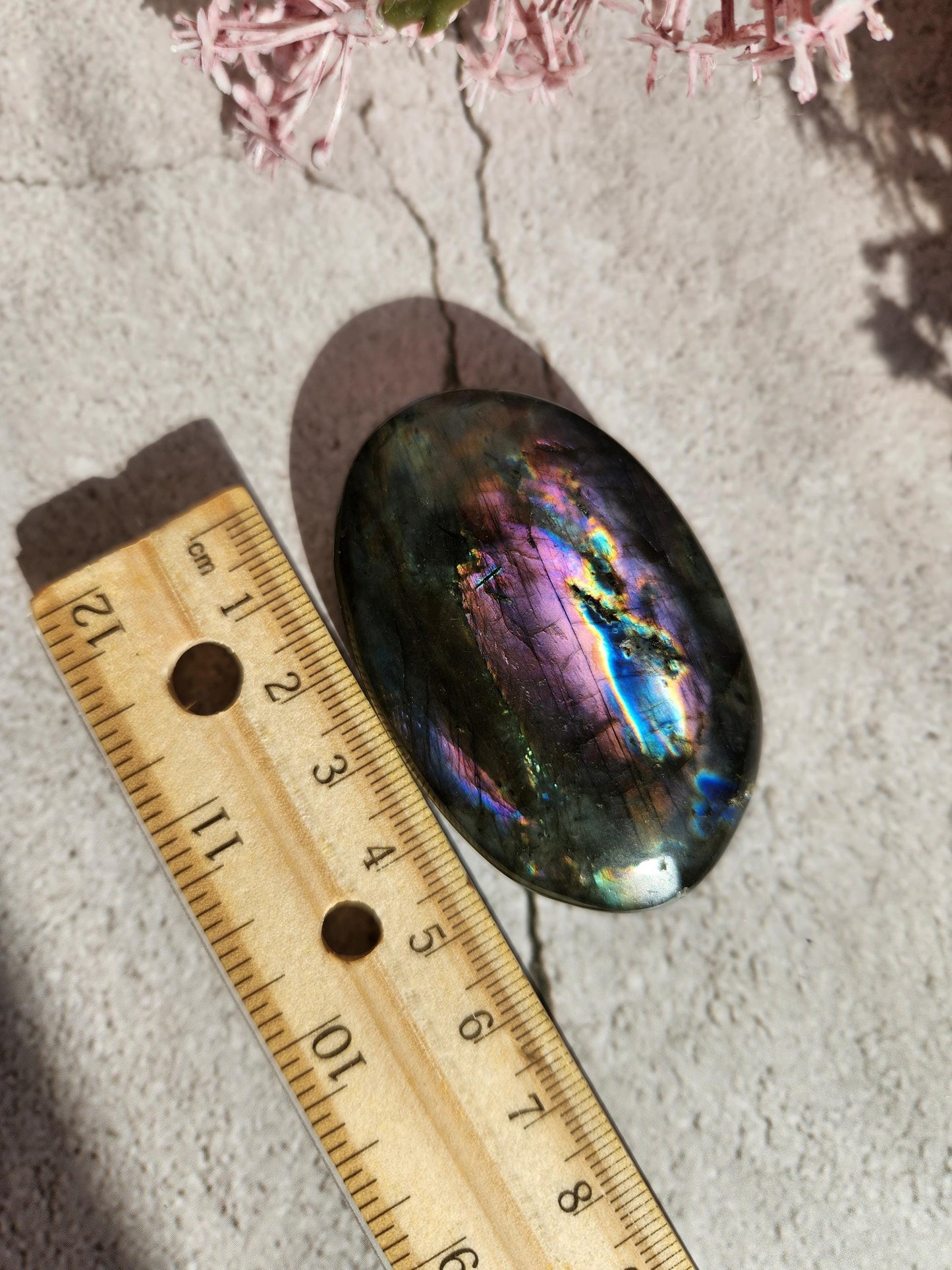 AAA Rainbow purple labradorite palm stone with silver sheen from Finland