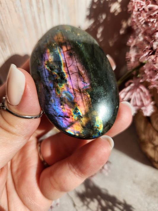 AAA Rainbow purple labradorite palm stone with silver sheen from Finland